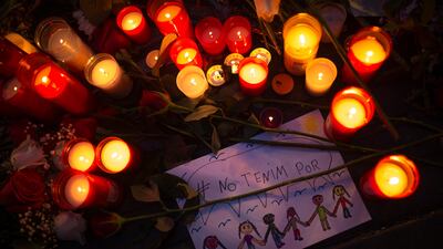 Candles and flowers placed on the ground for the victims of an terror attack that left many killed and wounded in Barcelona, Spain. Francisco Seco / AP