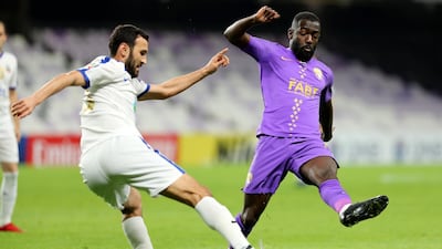 Ahmed Barman of Al Ain, right, and Bunyodkor's Murod Khalmukhamedov. Chris Whiteoak / The National