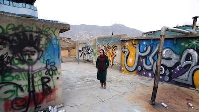 Afghan artist Shamsia Hassani poses for a photograph on the roof of her graffiti workshop in Kabul on March 2. Reuters