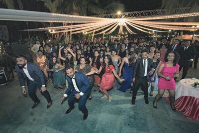 Elroque Pereira dancing with family and friends in modern times at a wedding party. Courtesy Elroque Pereira