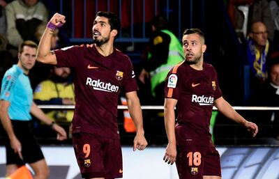 Barcelona forward Luis Suarez, left. Jose Jordan / AFP