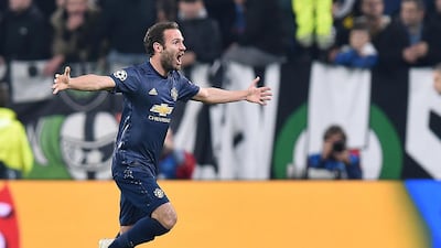 Juan Mata wheels away in celebration after scoring from a free kick. EPA