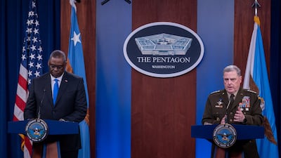 US Defence Secretary Lloyd Austin, left, and chairman of the Joint Chiefs of Staff General Mark Milley brief reporters at the Pentagon. Reuters