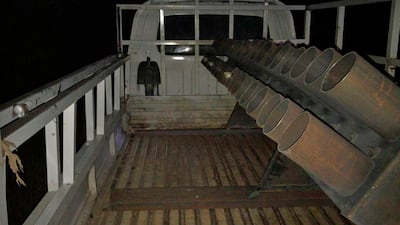 A barrage of rockets hit a base housing coalition troops north of Baghdad in March. AP