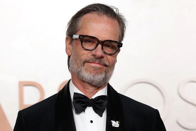 Guy Pearce wears a "Free Palestine" pin on the Oscars red carpet on Sunday. Reuters