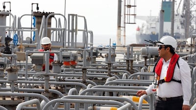 Iranian technicians work at the Kharg oil terminal. Sanctions have raised the price of Iranian crude for China due to tighter shipping capacity and higher freight costs. EPA