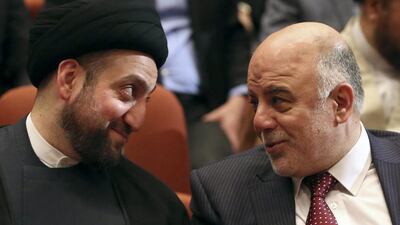 Iraq's new Prime Minister Haider Al Abadi and Ammar Al Hakim, leader of the Supreme Islamic Council of Iraq, meet during the session to approve the new government in Baghdad. Al Abadi has formed a government made up of traditional rivals (REUTERS/Hadi Mizban/Pool)