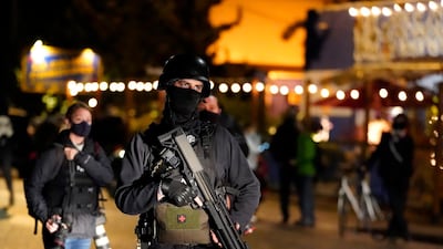 A person carries a gun while marching on the night of the election, in Portland, Oregon. AP Photo