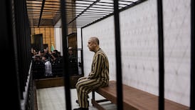 Atif Najib, a former army brigadier general and head of political security in Deraa, at a trial session at the Palace of Justice in Damascus on Sunday. Reuters