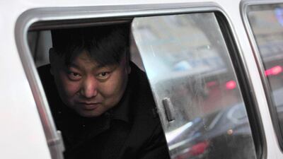 Xia, a 38-year-old lookalike of North Korean leader Kim Jong Un, looks out from a vehicle near his street food stall in Shenyang, Liaoning province. Reuters / March 22