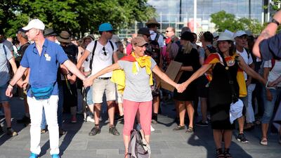 People form a human chain near the Chancellery during a protest against the government's restrictions amid the coronavirus disease (COVID-19) outbreak, in Berlin, Germany. REUTERS