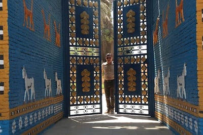 Qahtan Al Abeed, director of Iraq’s Basra Antiquities Department, at the entrance of a replica of the Ishtar Gate in Babylon. Courtesy Qahtan Al Abeed
