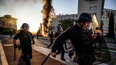 Riot police run along a street in Toulouse during nationwide demonstrations in France by the Bloquons Tout (Block Everything) protest movement. AFP