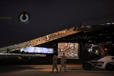 Palettes of aid for Lebanon unloaded from a UAE cargo aircraft at Beirut International Airport. Reuters