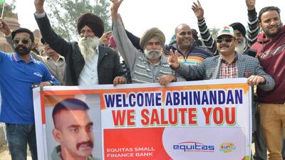 People shout slogans near the India-Pakistan border in Wagah as they wait for the return of an Indian Air Force pilot being returned by Pakistan. AFP