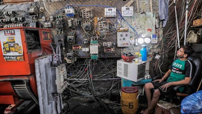 An electric switchboard technician keeps an eye on power-generating equipment in a Baghdad suburb where the national electricity grid is struggling to cope with the power demand caused by a severe heatwave.
