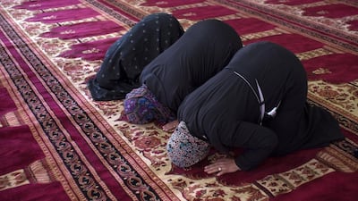 Palestinian women pray inside of the Sheikh Khalifa bin Zayed Mosque, in Izzariya, in the outskirts of Jerusalem (Photo for The National by Heidi Levine).