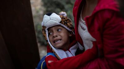 A boy cries as he and other migrants, try to reach the United States in Tijuana, Mexico. Reuters