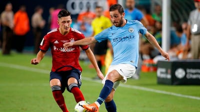 Manchester City's Bernardo Silva vies for the ball with Bayern Munich's Jonathan Meier. AFP