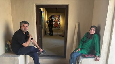 Mohammed Al-Hawajri and Dina Mattar at Al Jahili Fort, where Mattar's paintings are on show. Photo: DCT – Abu Dhabi