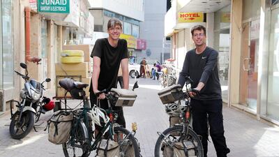 Dominik Fischer and Simon Helmecke enjoy the sights in Deira during the Use leg of their mammoth journey from Germany to New Zealand and back. Pawan Singh / The National