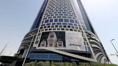 A sign on the side of Damac Towers in Dubai congratulates the Al Maktoum family on weddings of Sheikh Hamdan, Sheikh Maktoum and Sheikh Ahmed on Thursday. Chris Whiteoak / The National