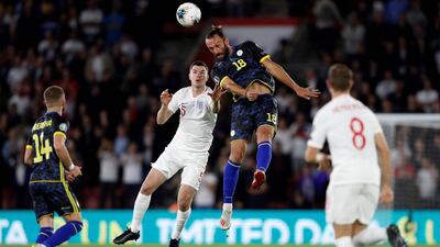 England defender Michael Keane vies with Kosovo forward Vedat Muriqi during the Euro 2020 qualifying Group A match at St Mary's Stadium in Southampton, southern England. AFP