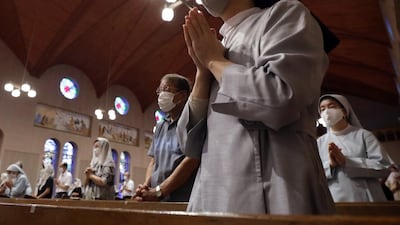 Churchgoers pray during an early morning mass at Urakami Cathedral in Nagasaki to mark the 76th anniversary of the atomic bombing of the Japanese city on August 9, 1945.