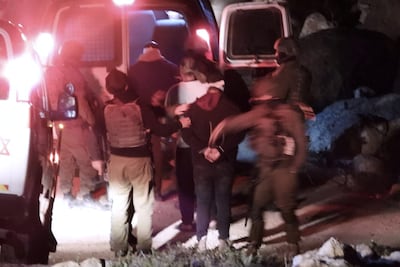 Hamdan Ballal being detained by the Israeli military from his home in the Israeli-occupied West Bank. AP