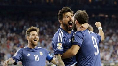 Argentina's Gonzalo Higuain, No 9, celebrates his goal against the United States with Lionel Messi, left, and Ezequiel Lavezzi, centre, during a Copa America semi-final on Tuesday in Houston. Eric Gay / AP Photo