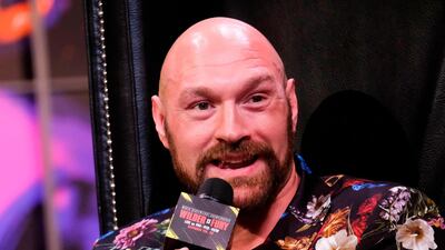 Tyson Fury speaks during a press conference with Deontay Wilder. AFP