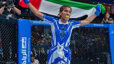 The UAE's Zamzam Al Hammadi celebrates her gold medal win at the IMMAF World Youth Championships in Abu Dhabi on Saturday. Image: UAEMMAF