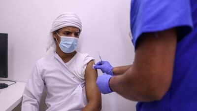 Abdullah Al Mansoori, 17, a student at Zayed University, is vaccinated before entering the army at Seha Vaccination Centre, Abu Dhabi Cruise Terminal, Zayed Port.