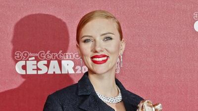 US actress Scarlett Johansson poses with her trophy after winning an honorary Cesar award. Ian Langsdon / EPA