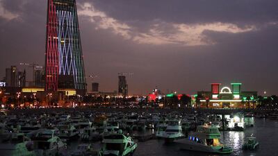 Kuwaiti buildings are illuminated in the colours of the national flag on February 20, 2021, as the country prepares to celebrate their 60th Independence Day and the 30th anniversary of the end of the Gulf war with the liberation of Kuwait from Iraqi occupation. AFP