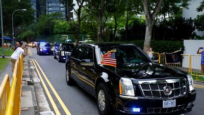 The motorcade of US President Donald Trump travels towards Sentosa for his meeting with North Korean leader Kim Jong Un. Feline Lim / Reuters