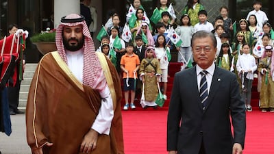 South Korean President Moon Jae-In, right, and Saudi Crown Prince Mohammed bin Salman walk to view an honour guard during a welcoming ceremony at the presidential Blue House. AP Photo