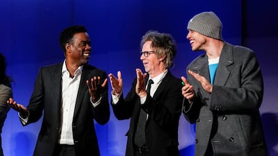 Comedians and actors Chris Rock, Dana Carvey and Pete Davidson applaud. Reuters