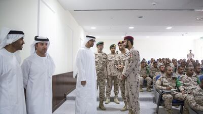 Sheikh Mohammed bin Zayed, Crown Prince of Abu Dhabi and Deputy Supreme Commander of the Armed Forces, inspects a classroom at the camp. With him are Sheikh Nahyan bin Zayed, left, Sheikh Hazza, second left, and Lt Gen Hamad Thani Al Romaithi. Ryan Carter / Crown Prince Court - Abu Dhabi