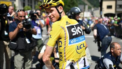 Great Britain’s Chris Froome (C), wearing the overall leader’s yellow jersey, waits prior to the start of the 184.5km ninth stage of the 103rd Tour de France cycling race on July 10, 2016 between Vielha Val d’Aran and Andorre Arcalis. Jeff Pachoud / AFP