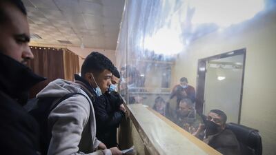 A Palestinian traveller presents documents at the Rafah border crossing. Bloomberg