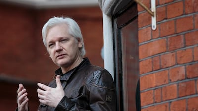 Julian Assange speaks to the media from the balcony of the embassy of Ecuador in London. (Photo by Jack Taylor/Getty Images)
