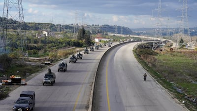 Military vehicles drive through Syria's Latakia province amid a military build-up around positions held by the Kurdish-led Syrian Democratic Forces near the Euphrates River. Reuters