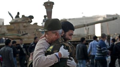 Egypt's new military rulers pledged yesterday to eventually hand over power to an elected civilian government and said the country would abide by its peace treaty with Israel.