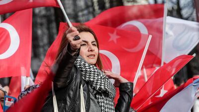 A member of a Turkish community welcomes Turkish President Erdogan ahead of a meeting and a press conference with NATO Secretary General Jens Stoltenberg in Brussels. EPA