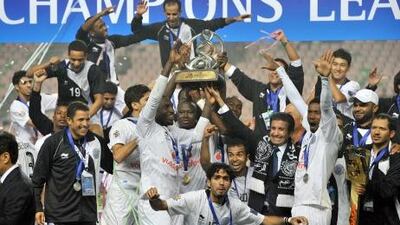 Al Sadd players celebrate with the trophy after winning the AFC Champions League football final last month.