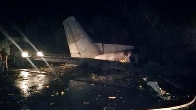 Wreckage of an AN-26 military plane is seen after it crashed in the town of Chuguyiv close to Kharkiv. Ukrainian Police Press Office via AP