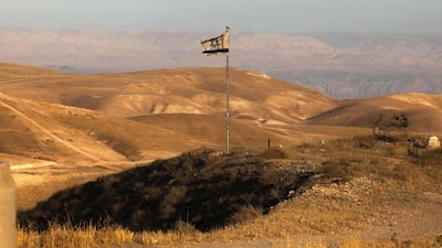 An Israeli flag flutters near the village of Khan Al Ahmar in the occupied West Bank, as a clamour to bar trade with areas of Israeli settlement gathers pace. AFP