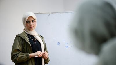 Majda Al-Riyani, a 29-year-old Libyan woman, teaches Arabic calligraphy to young girls at a training centre in Benghazi, Libya, March 15, 2022. Picture taken March 15, 2022. REUTERS / Esam Omran Al-Fetori