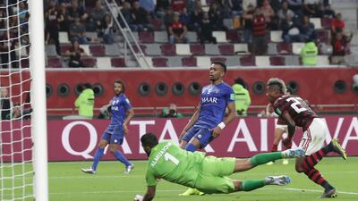 Flamengo's Bruno Henrique, right, scores his side's third goal. AP